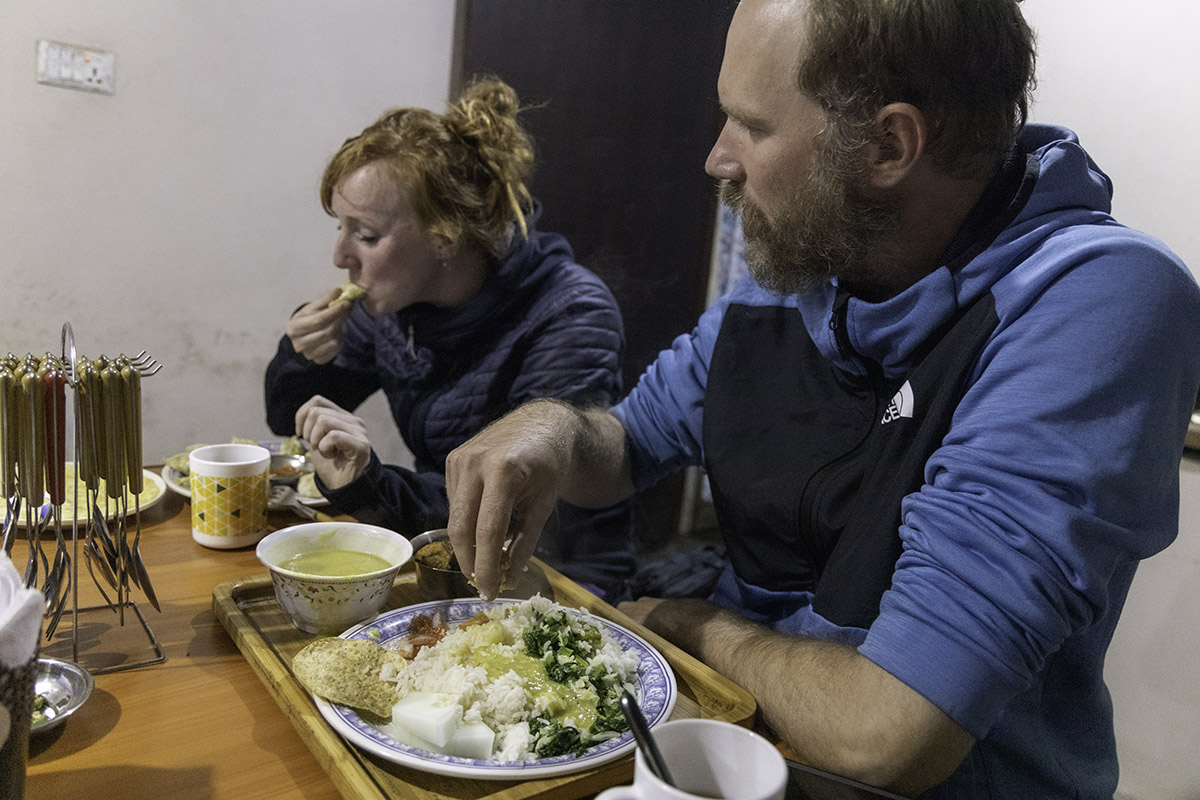 Trekkers having Food(daal bhat) during manaslu circuit Trek.